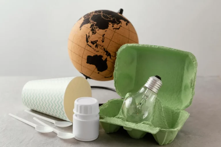 Recyclable materials representing Indonesia's waste-to-energy initiative, featuring a globe, light bulb, and eco-friendly packaging to symbolize sustainable waste management solutions.